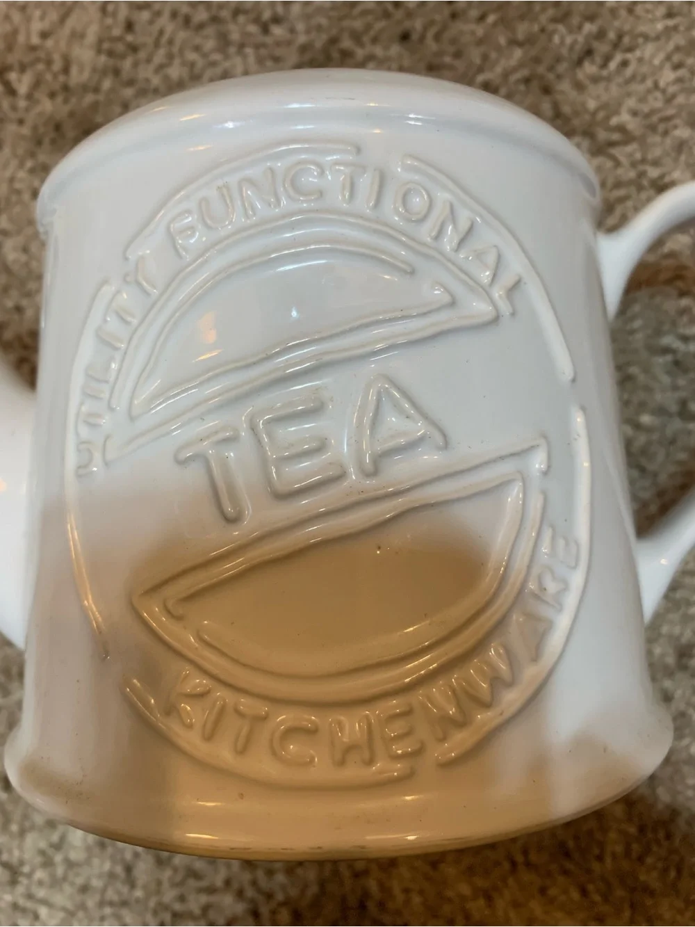 White Ceramic Teapot with Embossed 'Tea' Motif